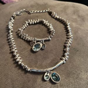 Uno de 50 matching bracelet and necklace.
